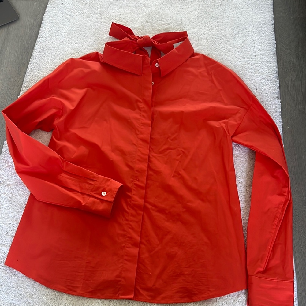 MSGM orange thirt, New without tag,  size 40.